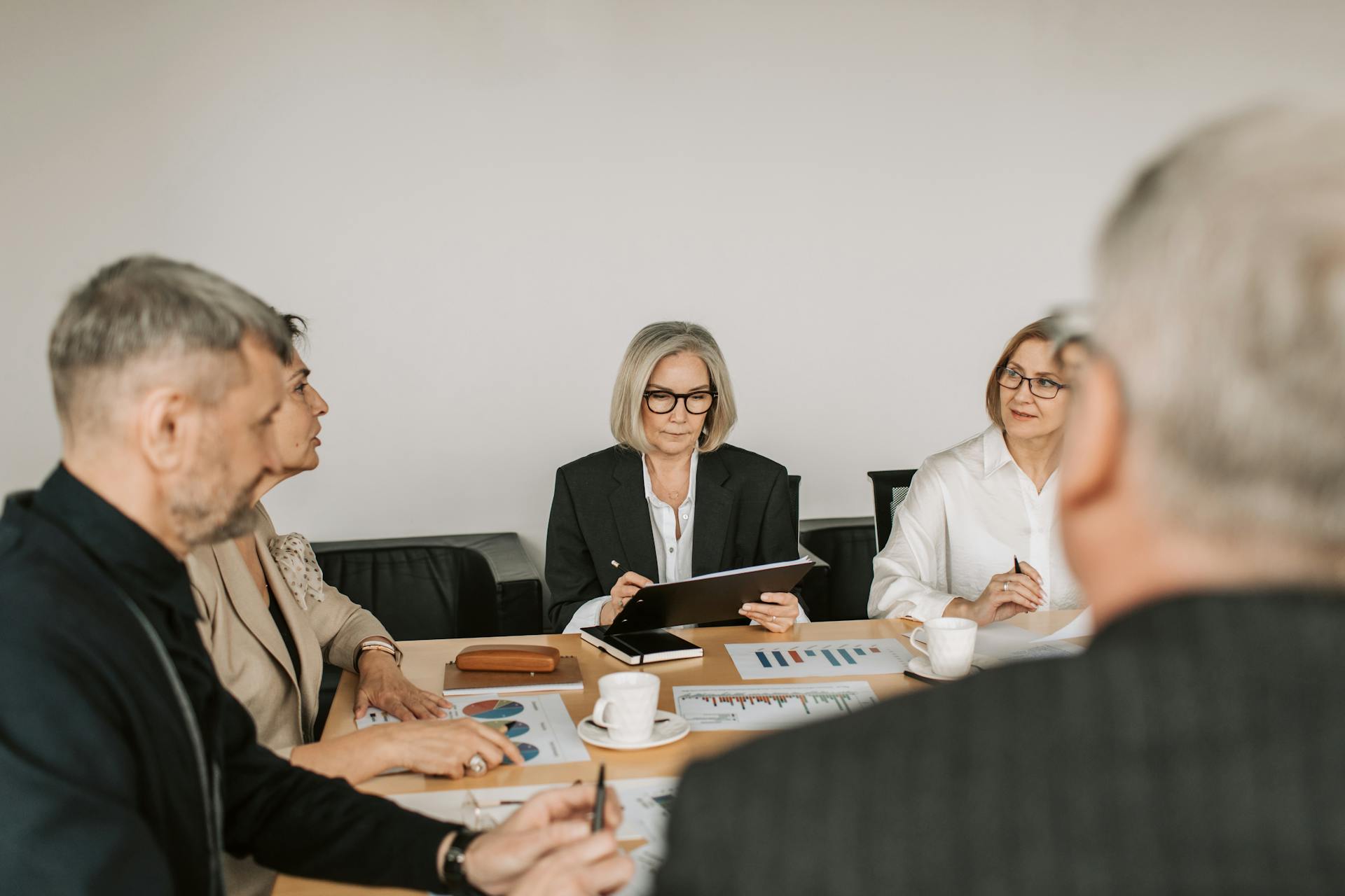 Service contract evaluation framework with procurement team reviewing vendor performance